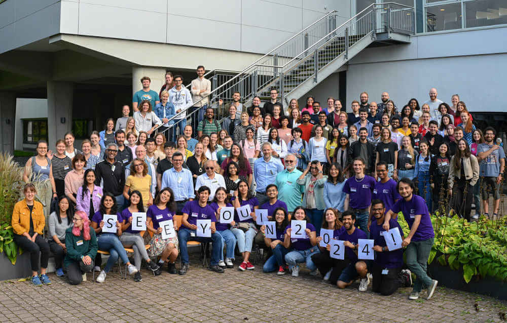 group photo from Horizons 2023 with the organizig team holding up letters that spell 'see you in 2024'