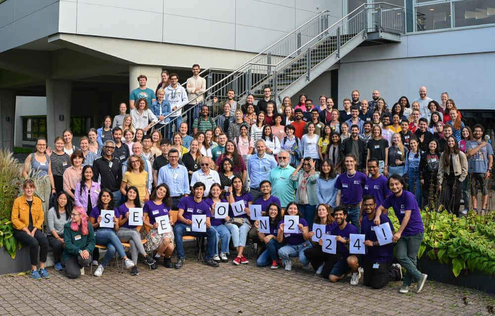 group photo from Horizons 2023 with the organizing team holding up letters that spell 'see you in 2024'