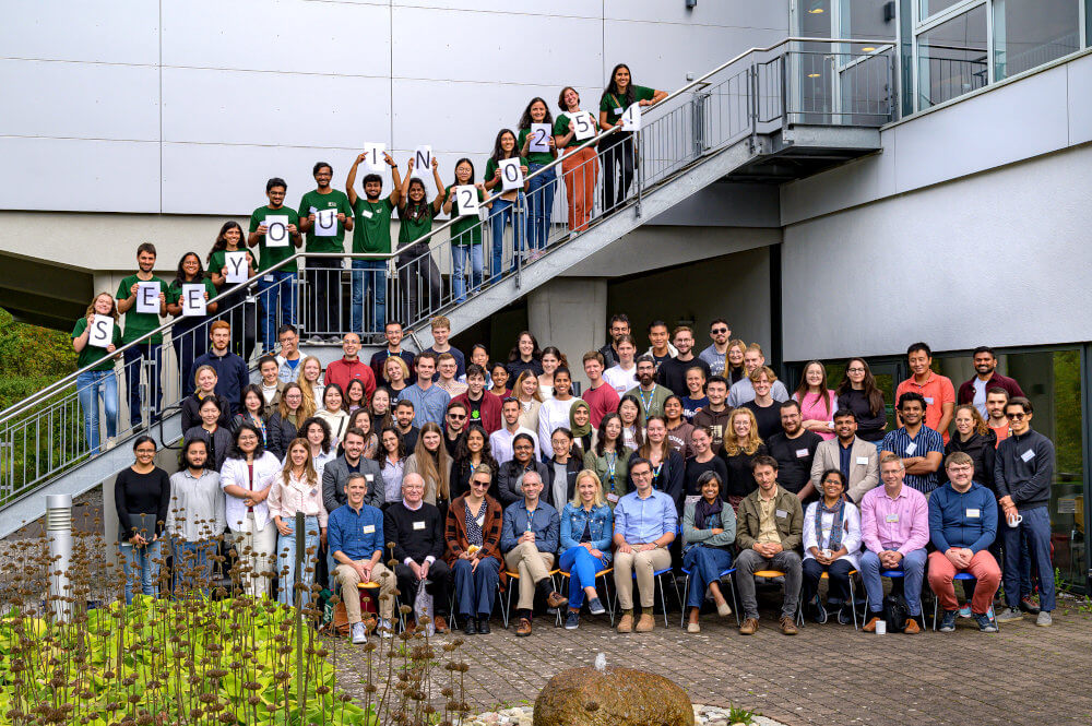 group photo from Horizons 2024 with the organizing team holding up letters that spell 'see you in 2025'